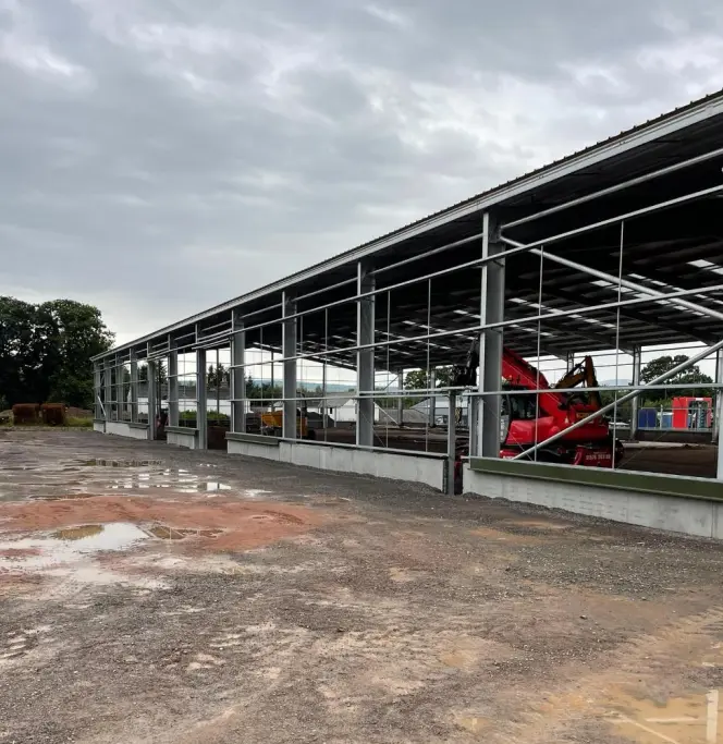 Steel fabrication workshop with welders at work